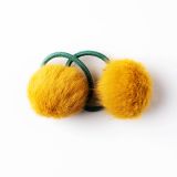 all-about-eva-elastiekje-pluizig-bolletje-geel